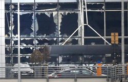 Broken windows seen at the scene of explosions at Zaventem airport near Brussels, Belgium