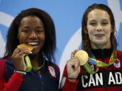 Simone Manuel & Penny Oleksiak of Canada: tied for gold, women's 100m freestyle