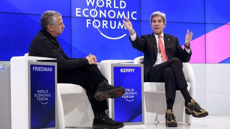 Outgoing US Secretary of State John Kerry (R) gestures as he speaks on the opening day of the World Economic Forum, on January 17, 2017, in Davos.(AFP PHOTO / FABRICE COFFRINI)