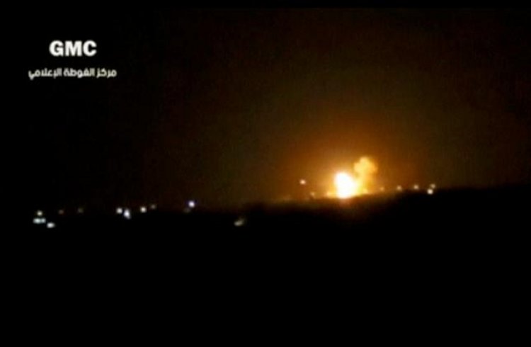 A video posted to social media shows explosions and rising flames, said to be in Damascus. Social Media Website via Reuters TV
