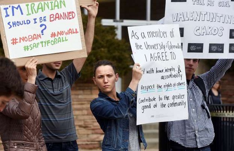Allie Morgan, a University of Colorado graduate student, is among dozens of people at a travel ban protest at the University of Colorado in Boulder on Thursday, Feb. 9, 2017. © Cliff Grassmick/Daily Camera via AP