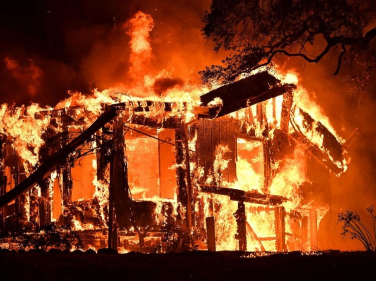 Flames ravage a home in the Napa wine region in California, Oct. 9, 2017, as multiple wind-driven fires continue to whip through the region.