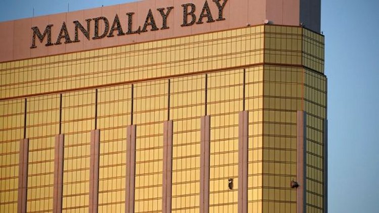 A gunman killed at least 58 people and injured hundreds Sunday night from the 32nd floor of the Mandalay Bay resort and casino. (AP Photo/John Locher)