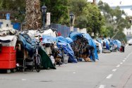 A row of homeless people on 17th Street in San Diego