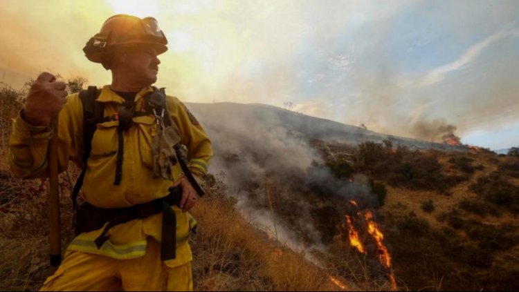 Crews fight to contain massive wildfires in California and Oregon