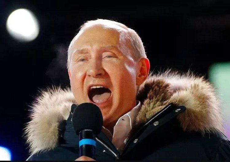 Russian President Vladimir Putin speaks to supporters during a rally near the Kremlin in Moscow, Sunday, March 18, 2018.