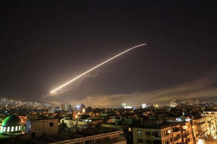 The sky above Damascus lights up with missile fire on April 14.