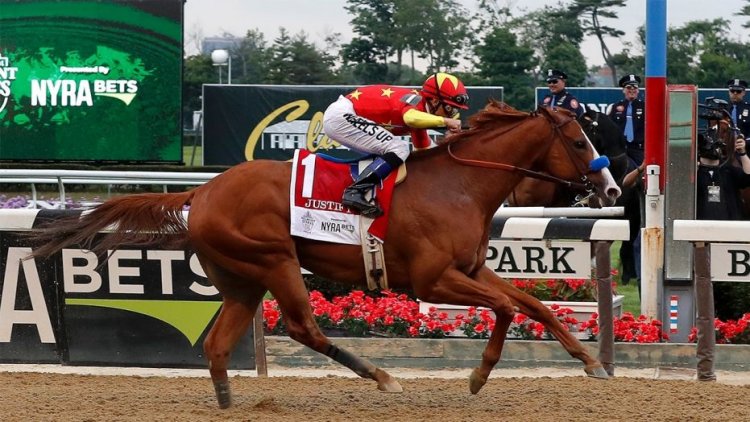 Justify (1), with jockey Mike Smith, crosses the finish line to win the 150th running of the Belmont Stakes horse race, Saturday, June 9, 2018, in Elmont, N.Y. (AP Photo/Julie Jacobson)