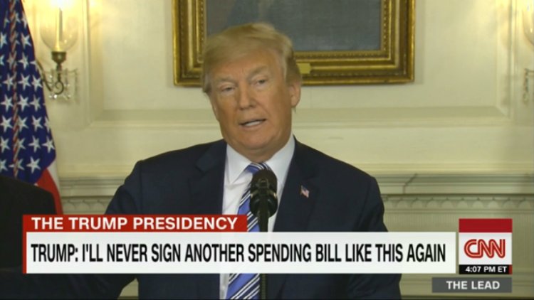 Trump signs spending bill despite veto threat