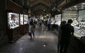 In this Sunday, August 12, 2018 photo, people visit a gold market at the Grand Bazaar in Tehran, Iran. (AP Photo/Vahid Salemi)