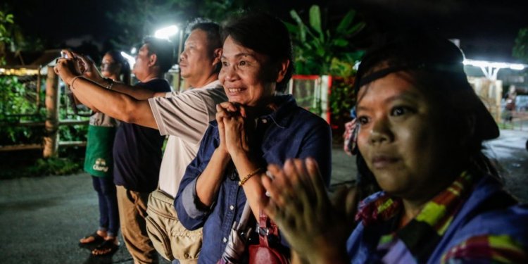 Onlookers cheered as ambulances delivered the rescued boys to a hospital in Chiang Rai, Thailand, on Sunday. Lauren DeCicca/Getty Images