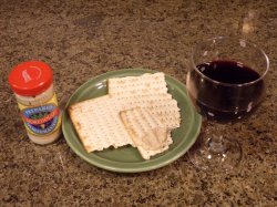 Wine (blood of the Lamb), matzo (unleavened bread), and horseradish (bitter herbs) on Passover